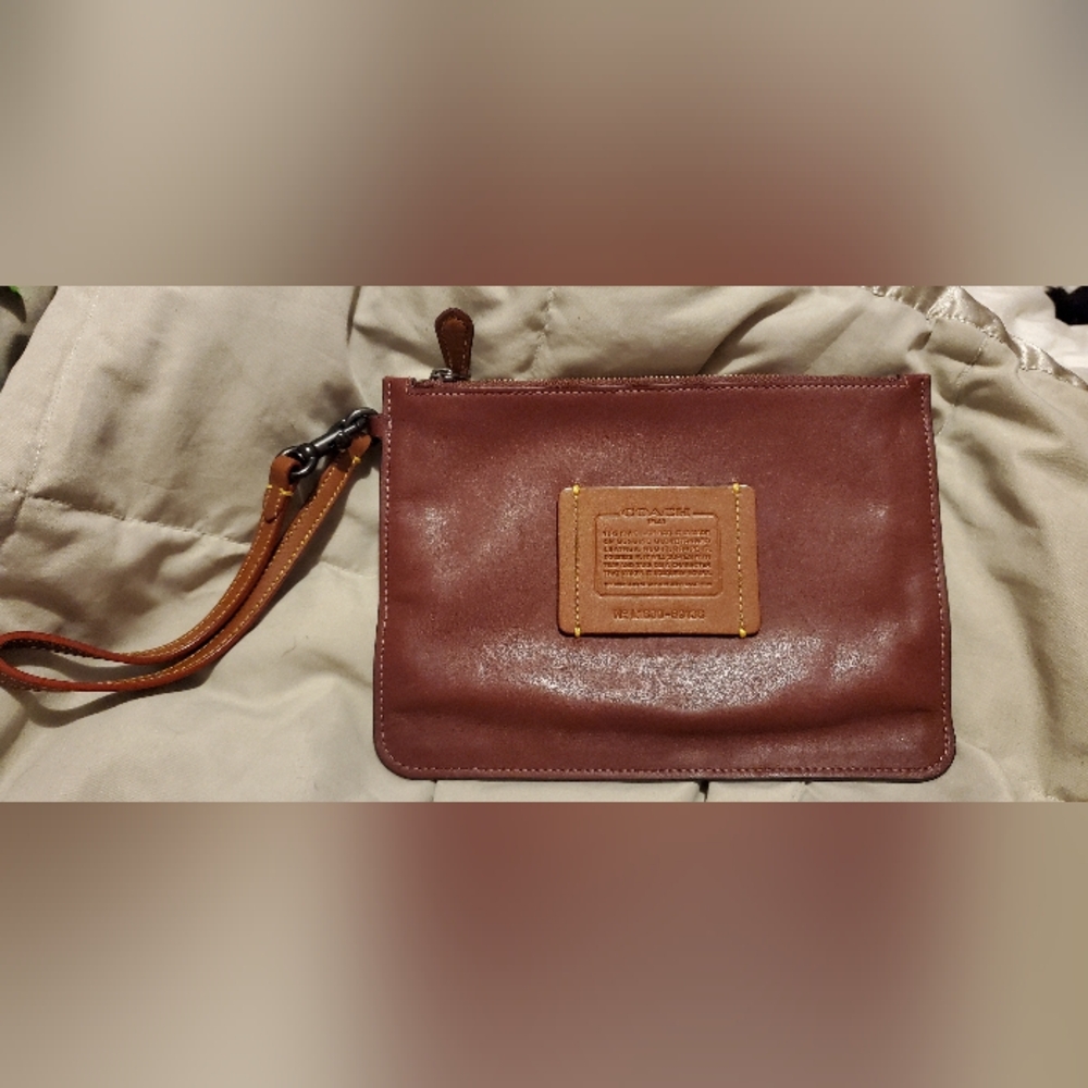 Coach pouch / wristlet in oxblood. Great used condition. Clean!